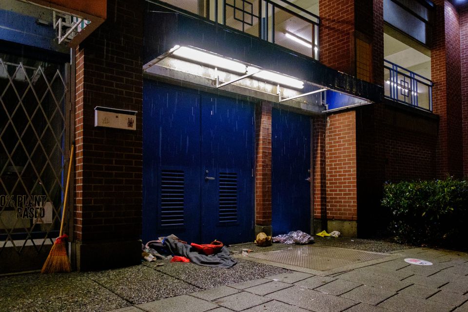 Blankets under an awning, abandoned in the rain; Chinatown, Vancouver