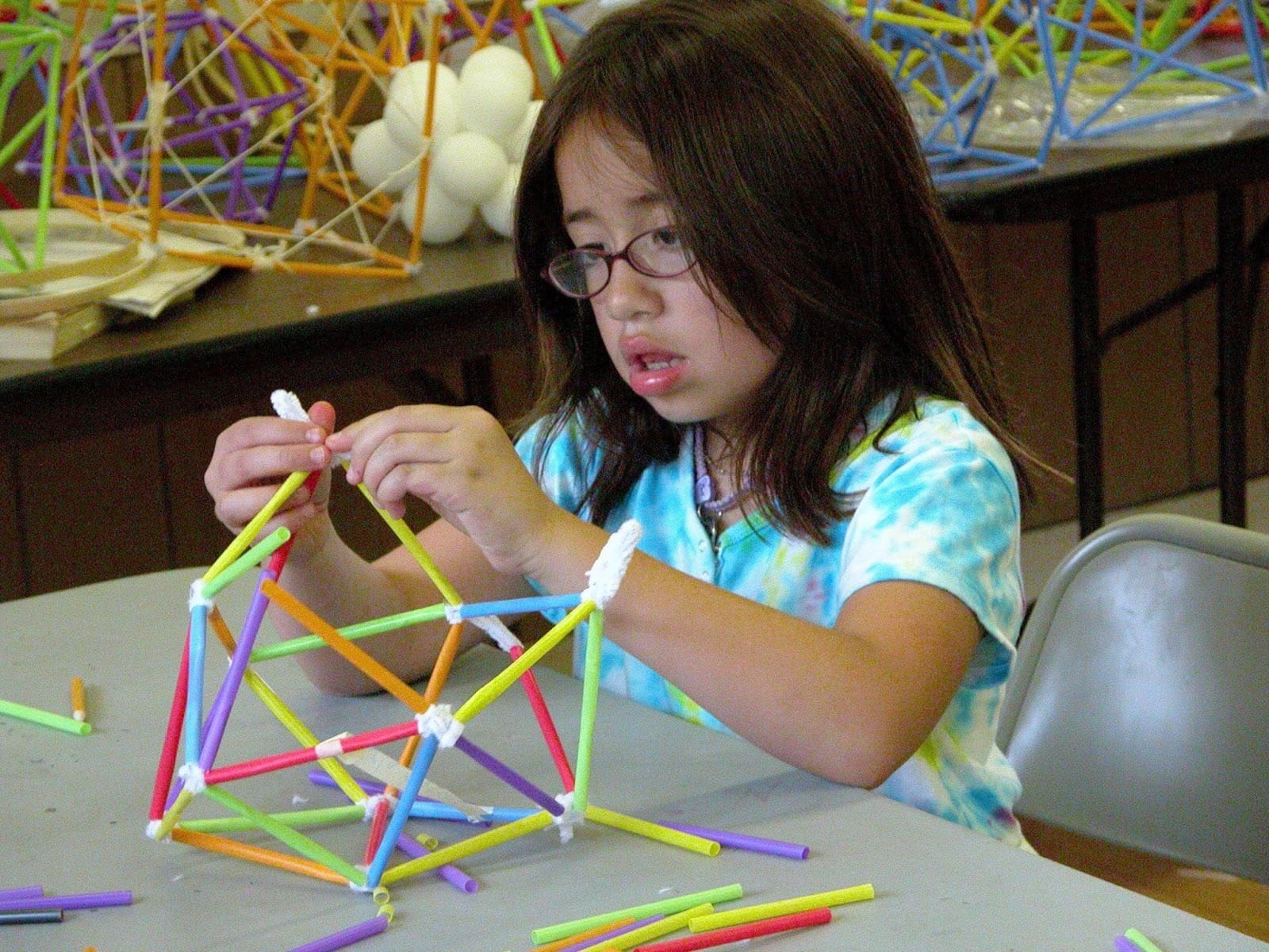 Small girl on geometry Knowledge of the human individual’s intellectual potential—which not only allows him or her to discover universal ordering principles, but also to create new, never before existing ordering principles—enables us to recognize therein a quality which is a reflected image of God. Credit: EIRNS/Stuart Lewis