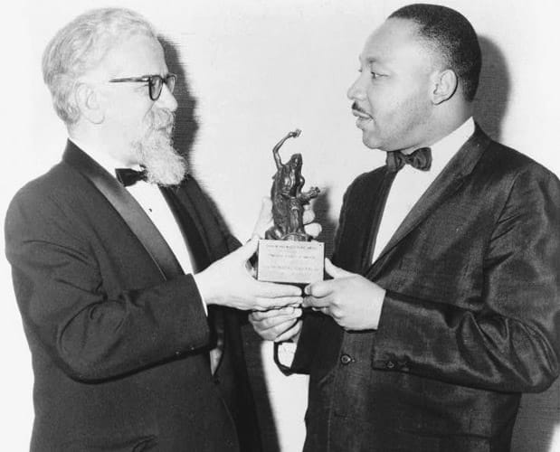 Rabbi Abraham Heschel, left, presents the Judaism and World Peace Award to Martin Luther King, Jr., December 7, 1965.