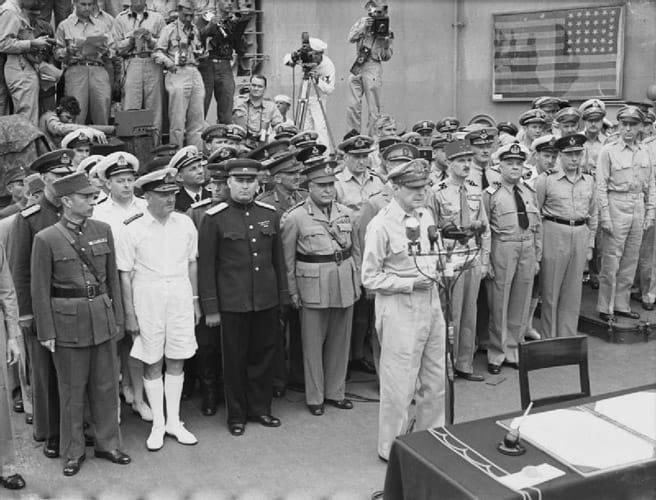 General Douglas MacArthur reads the surrender terms aboard the USS Missouri