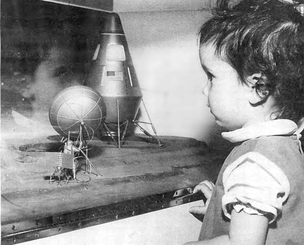 A youngster contemplates a model of a nuclear-propelled Mars lander, at the Nuclear Rocket Development Station in Nevada in 1966, during a Science Youth Day.
