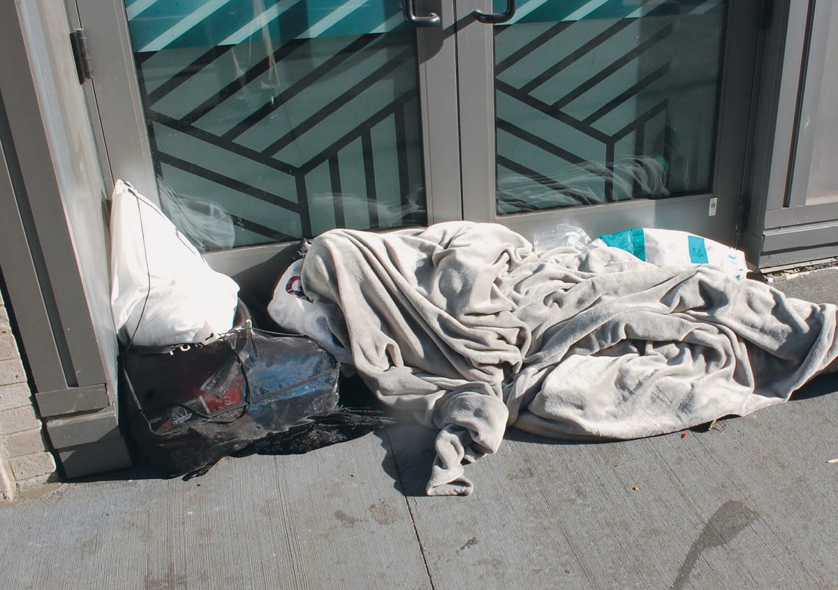 According to estimates, 4.2 million young Americans will experience homelessness in 2026. Here, a homeless person in New York City.