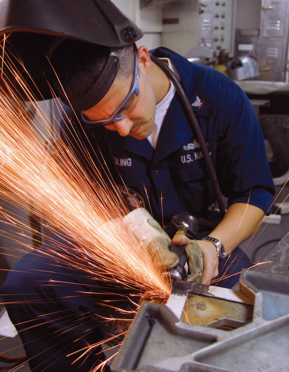 Welder aboard a nuclear-powered supercarrier
