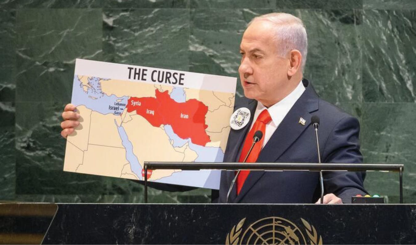Israeli Prime Minister Benjamin Netanyahu addresses the UN General Assembly, September 27, 2024, with a map showing Gaza, Lebanon, Syria, Iraq, Yemen, and Iran as "The Curse." Notably, the West Bank is not pictured.