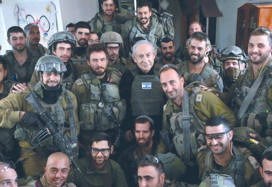 Israeli Prime Minister Benjamin Netanyahu with troops in northern Gaza.