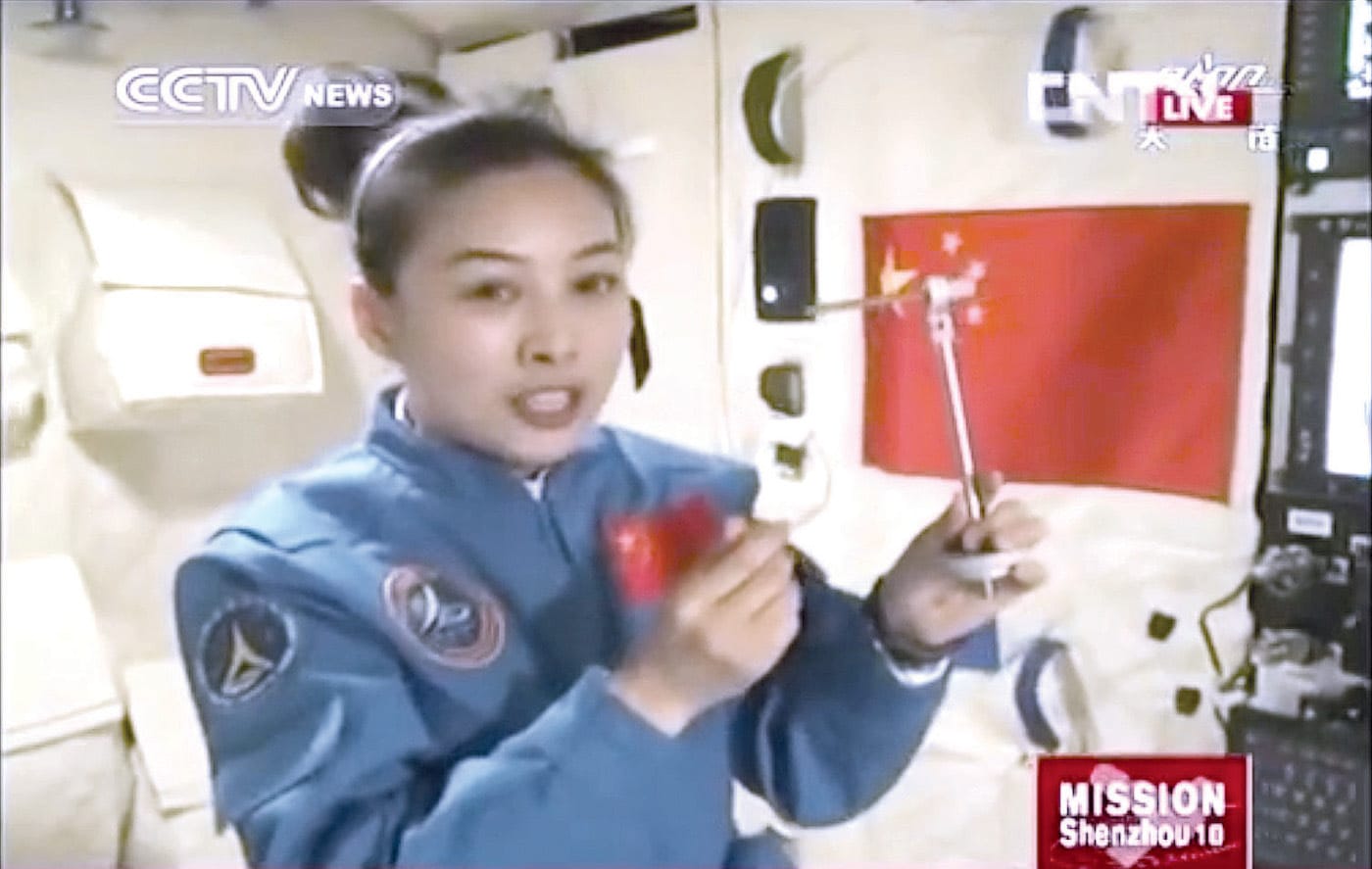 The crew of China’s Shenzhou-13 mission teach a science class from the Tiangong space station, livestreamed to millions of Chinese students, Dec. 9, 2021.