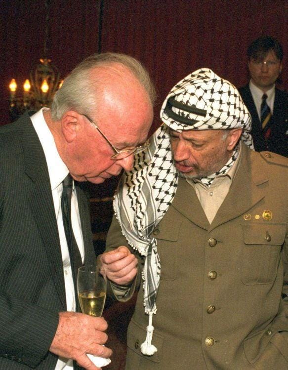 Israeli Prime Minister Yitzhak Rabin (left) and Palestinian leader and chairman of the Palestine Liberation Organization (PLO) Yasser Arafat before receiving the 1994 Nobel Peace Prize.
