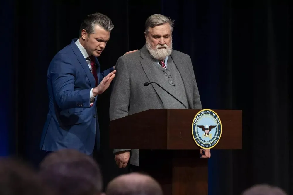 Hegseth holding Doug Wilson