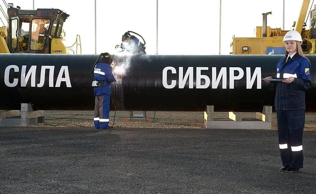 welders at work connecting the first section of the Power of Siberia pipeline