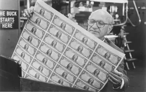 Nazi economist Milton Friedman gazes lustfully at newly printed dollars. This was apparently the closest he came to experiencing love.