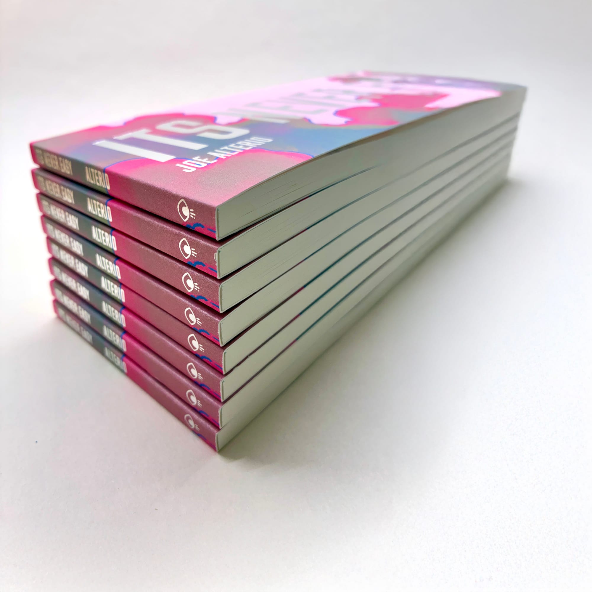 A stack of graphic novels, on seamless background