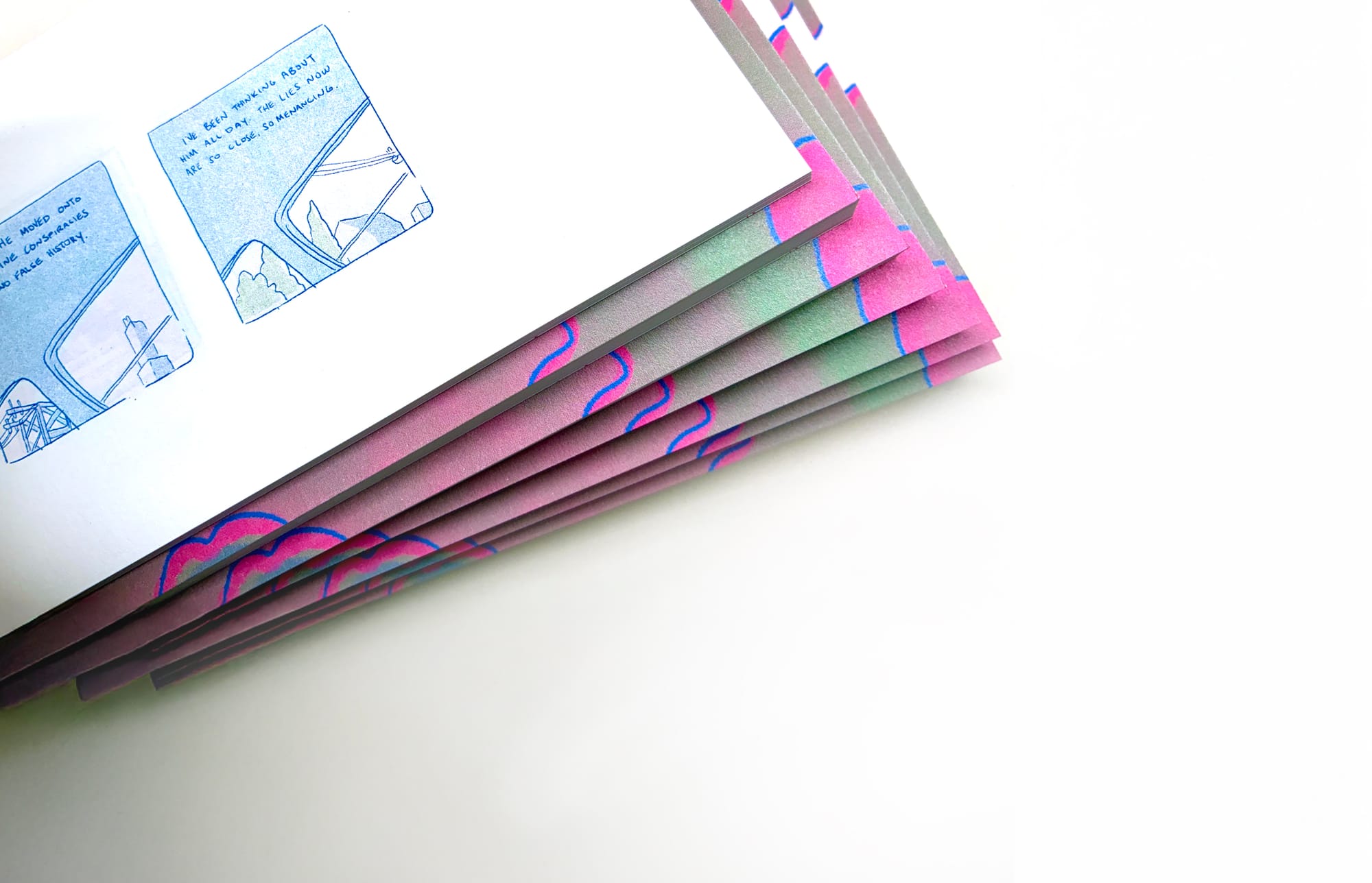A stack of graphic novels, on seamless background