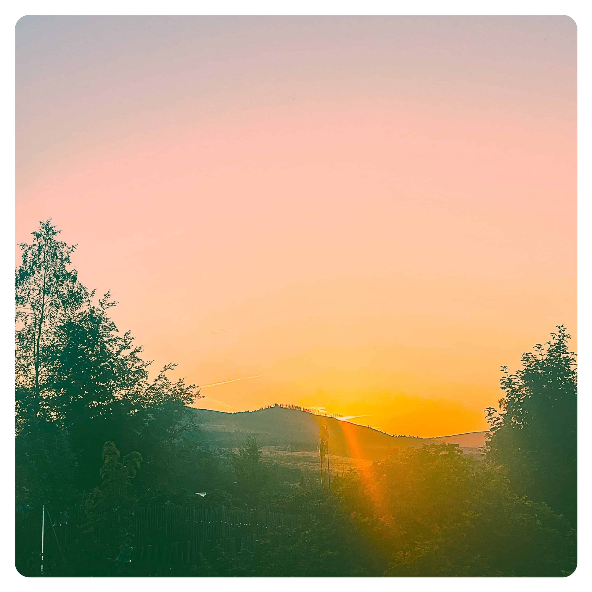 van life sunset over mountains from camper van campsite in Germany