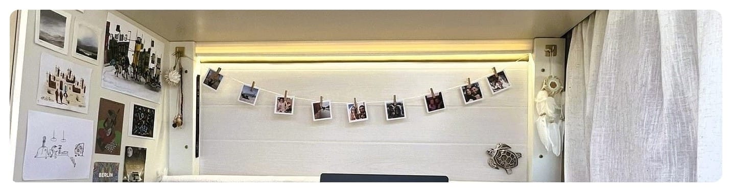 van life bench area with Polariod style photos on string