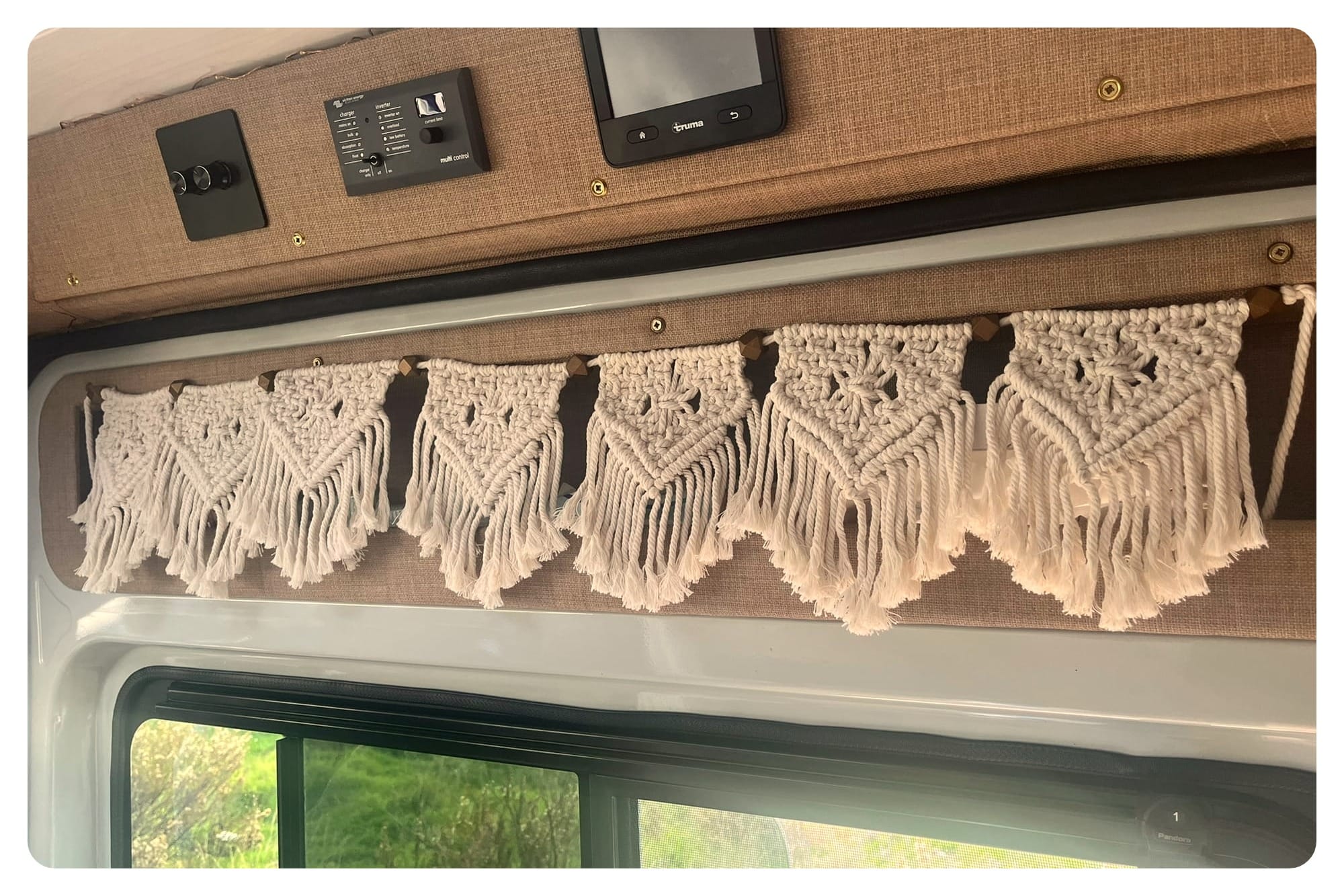 van life sliding door with boho-style macrame hanging garland