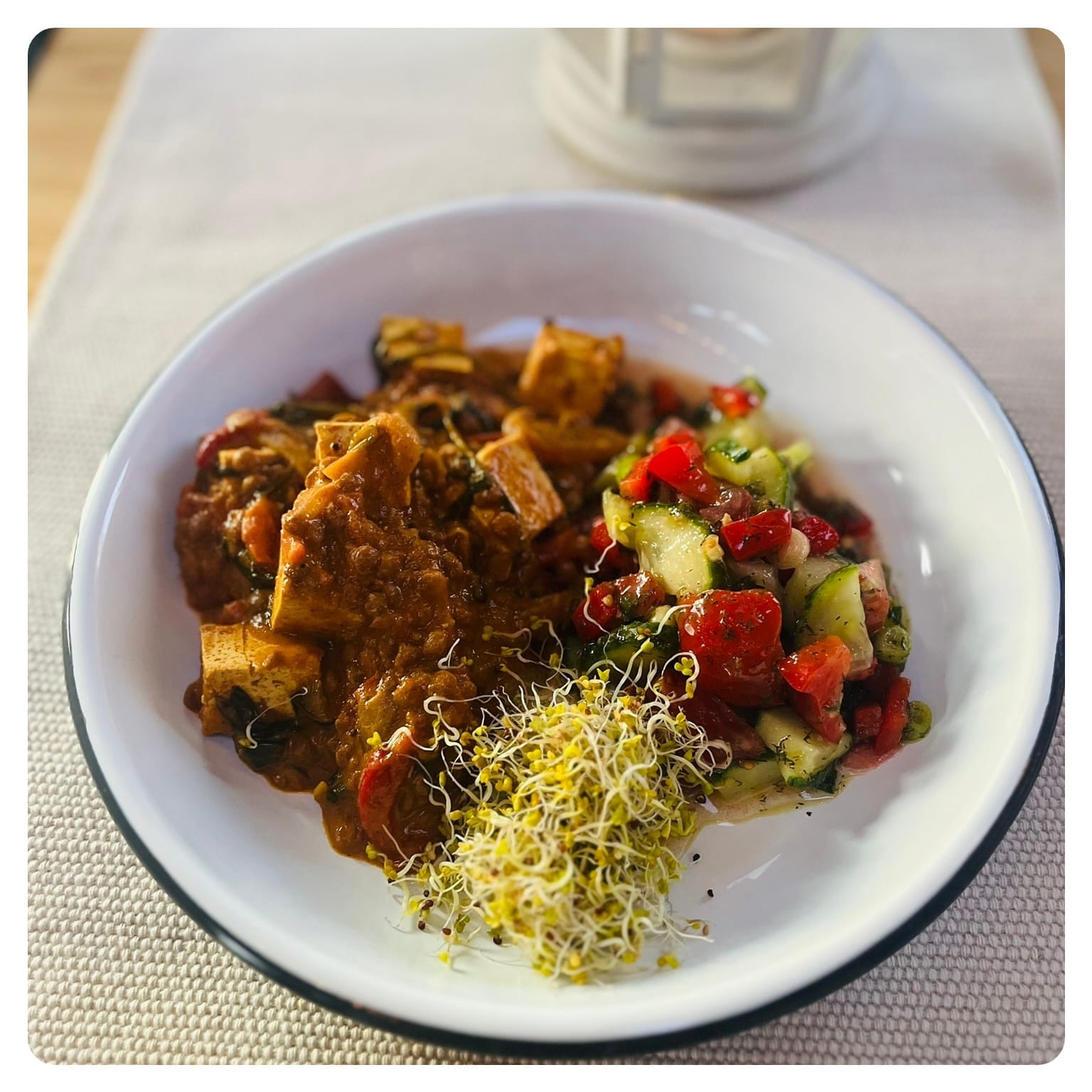 vanlavita bowl of health food of tofu lentil stew with side salad