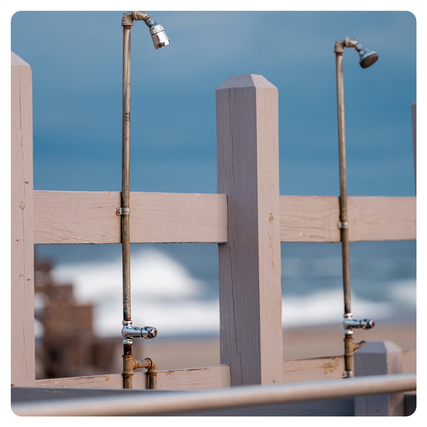 A close up of a fence on a beach
