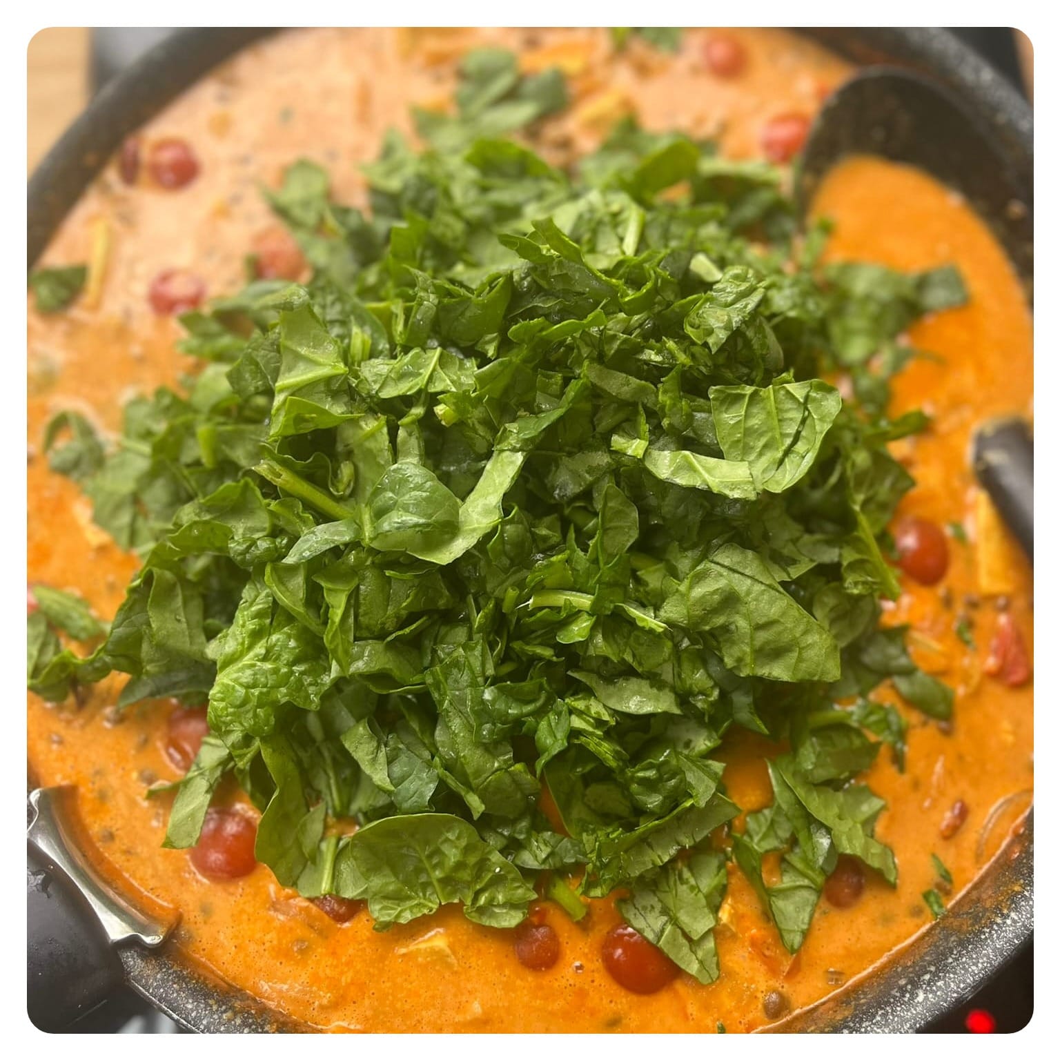 tofu curry being cooked in a pan