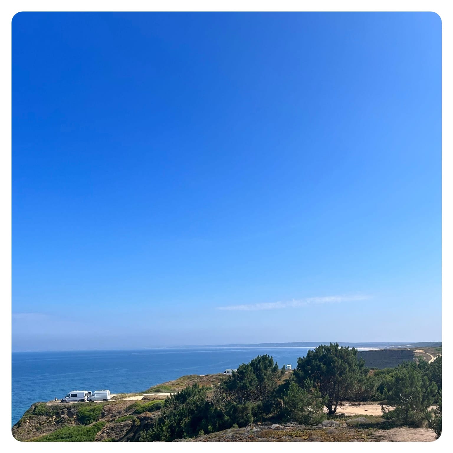 vanlife vanlavita van parked on cliffside overlooking sea in Portugal