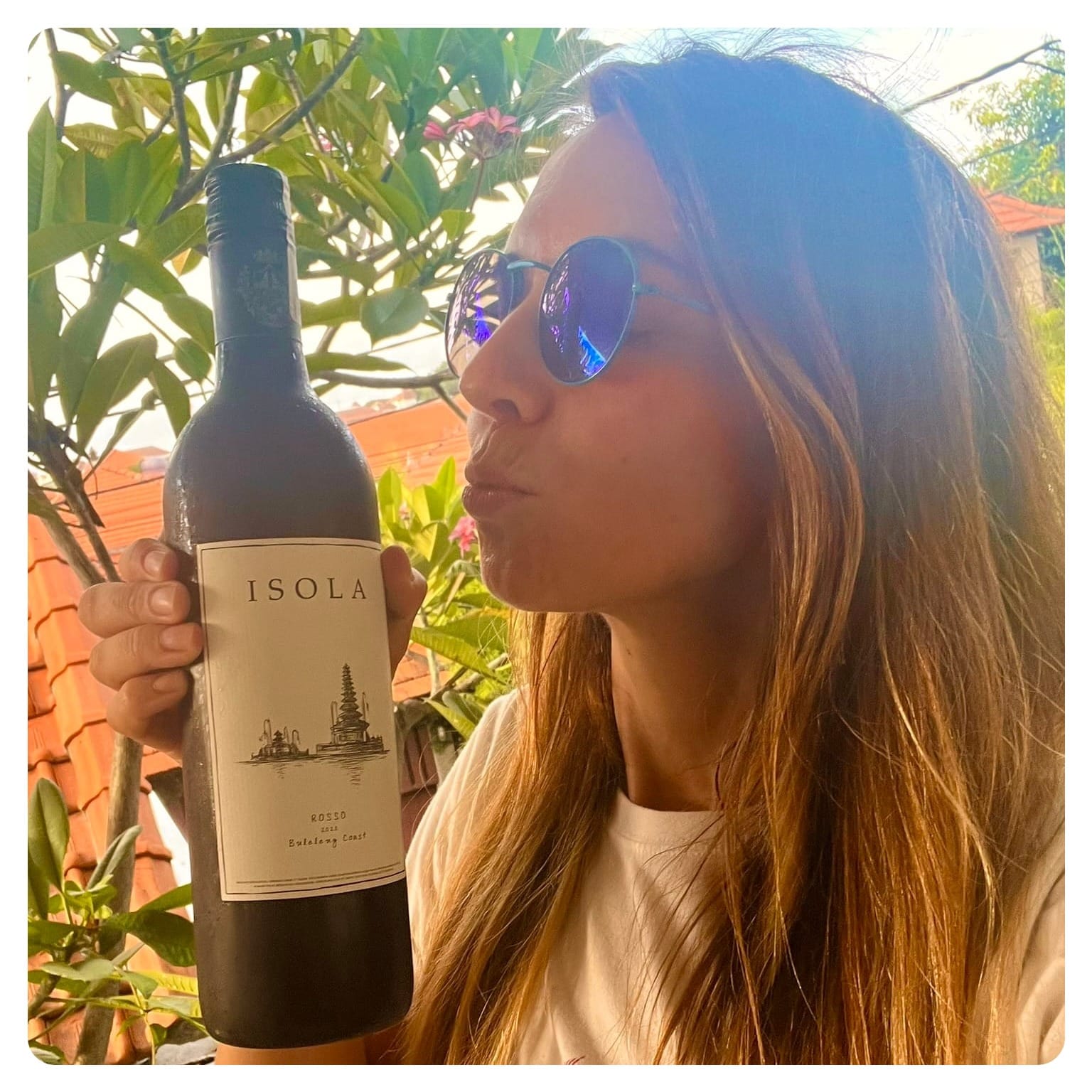 vanlavita woman holding bottle of red wine