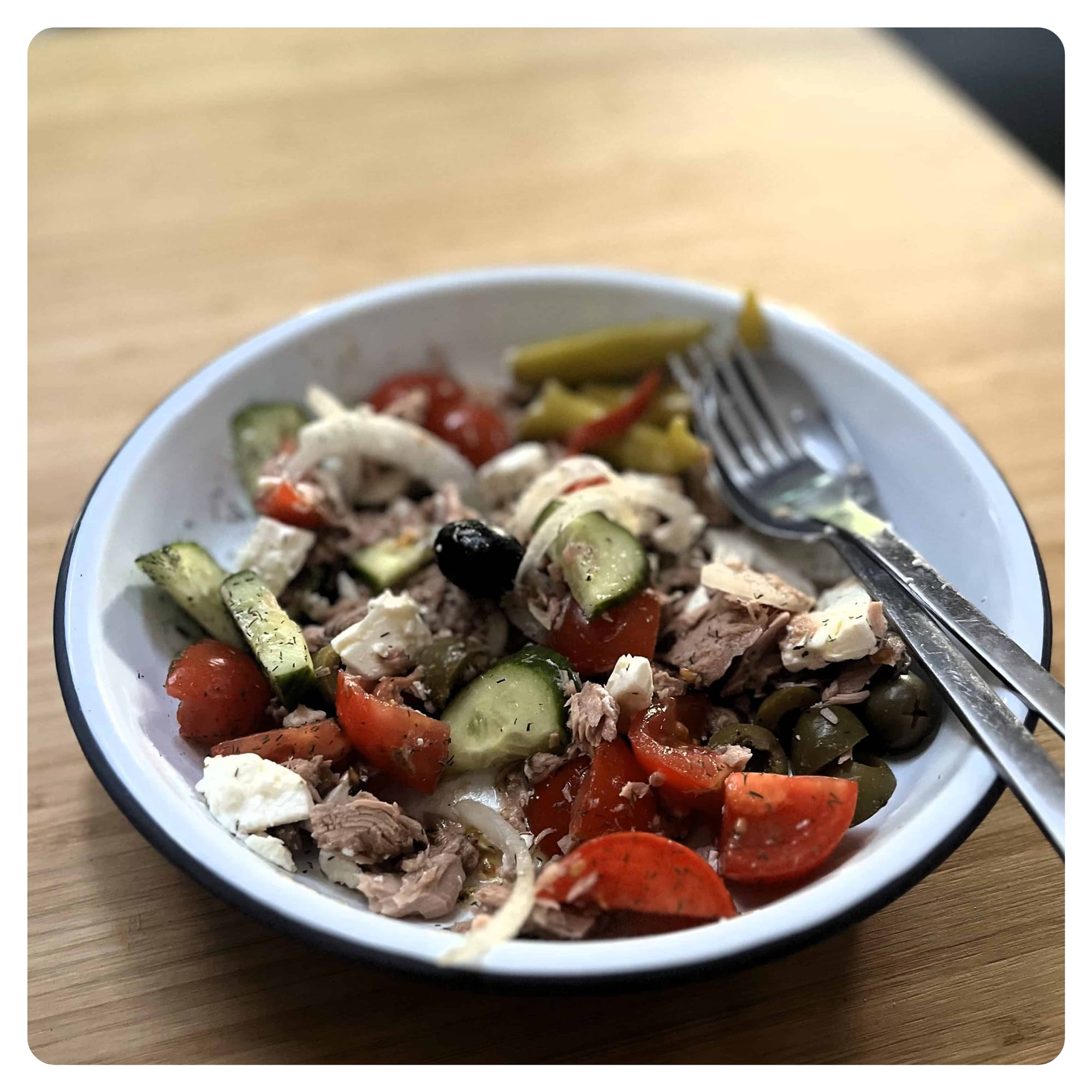 tuna salad served in white enamel bowl