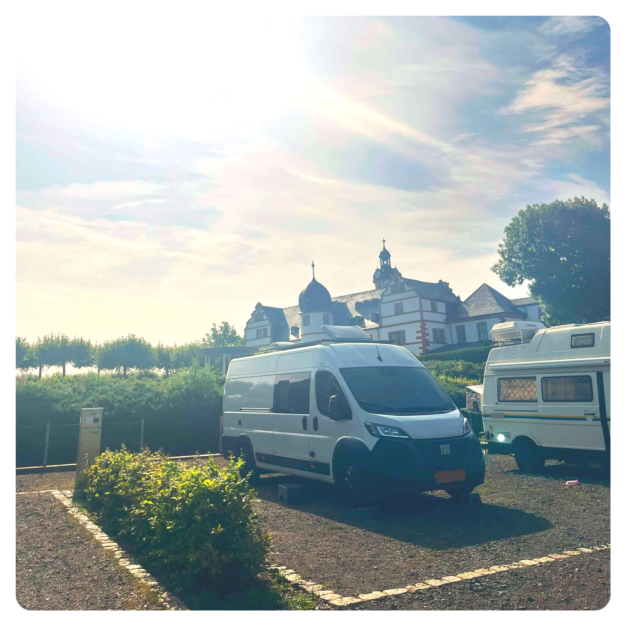 vanlife van and motorhomes parked next to castle in Ohrdruf, Germany