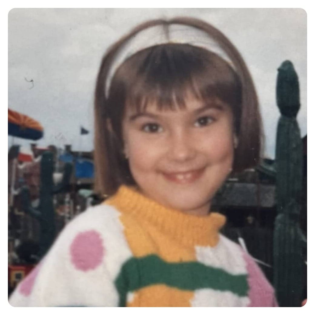 van life vanlavita woman as a young girl in colourful jumper