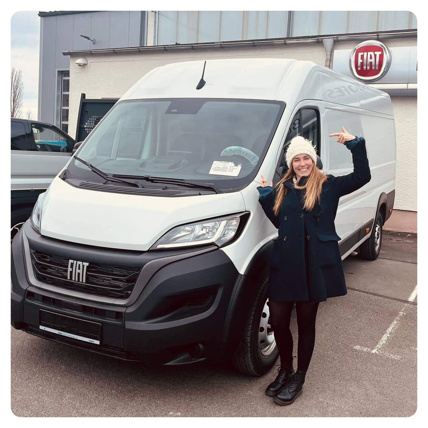 van life vanlavita woman stood next to white campervan