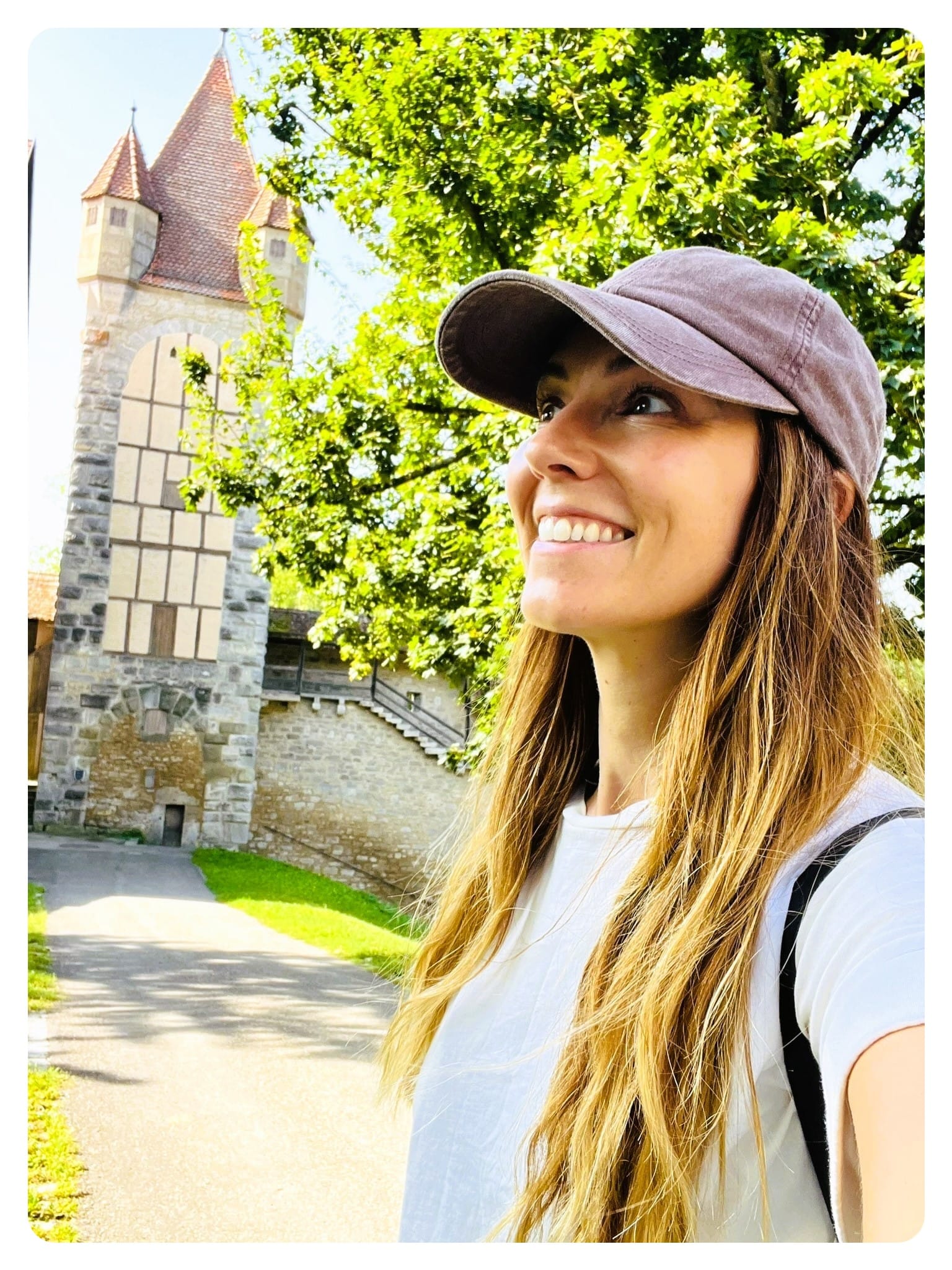 vanlife vanlavita woman smiling at a castle