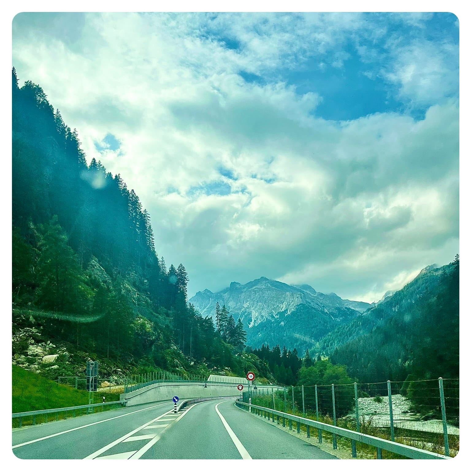 highway with mountain in the background