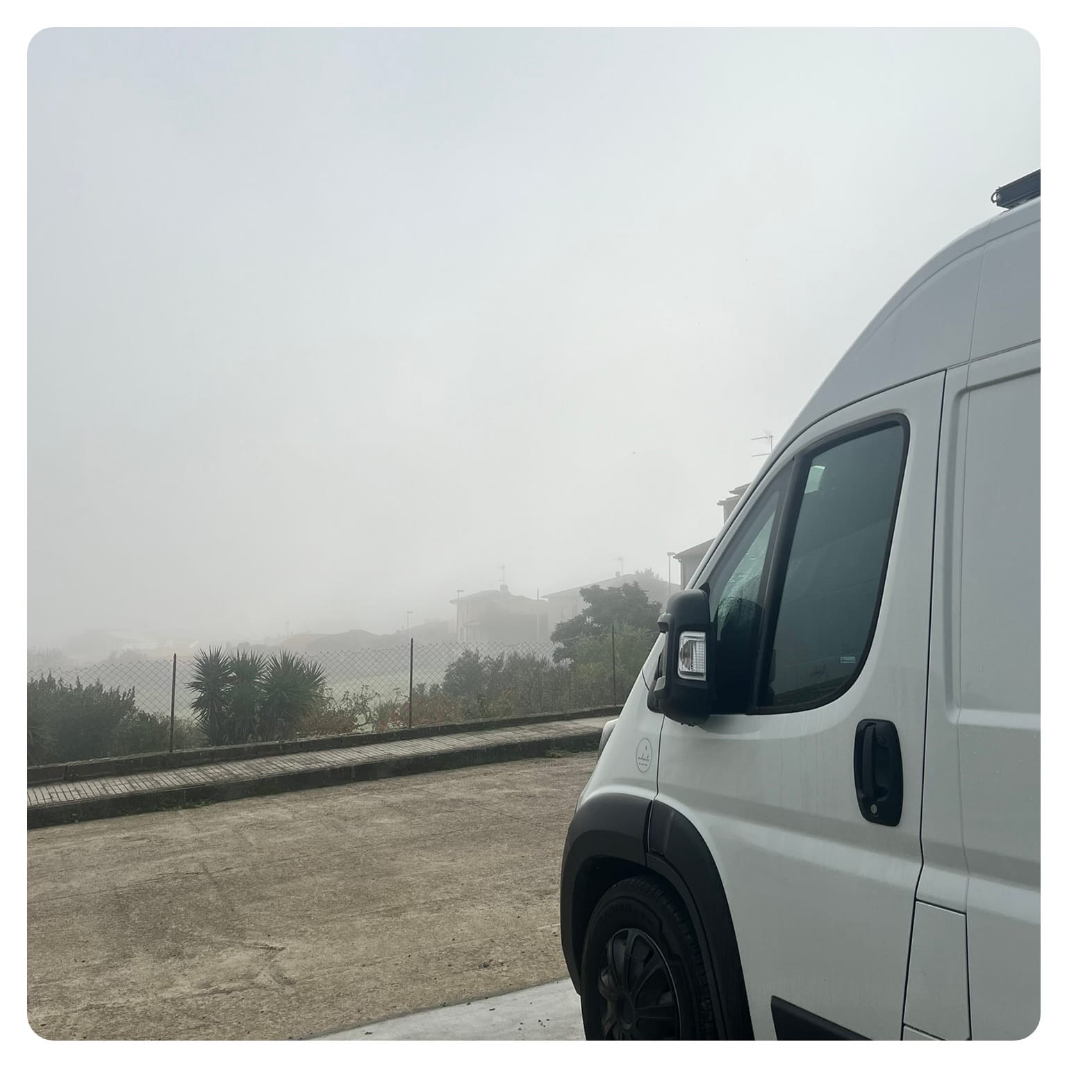 vanlife vanlavita view of van overlooking grey fog