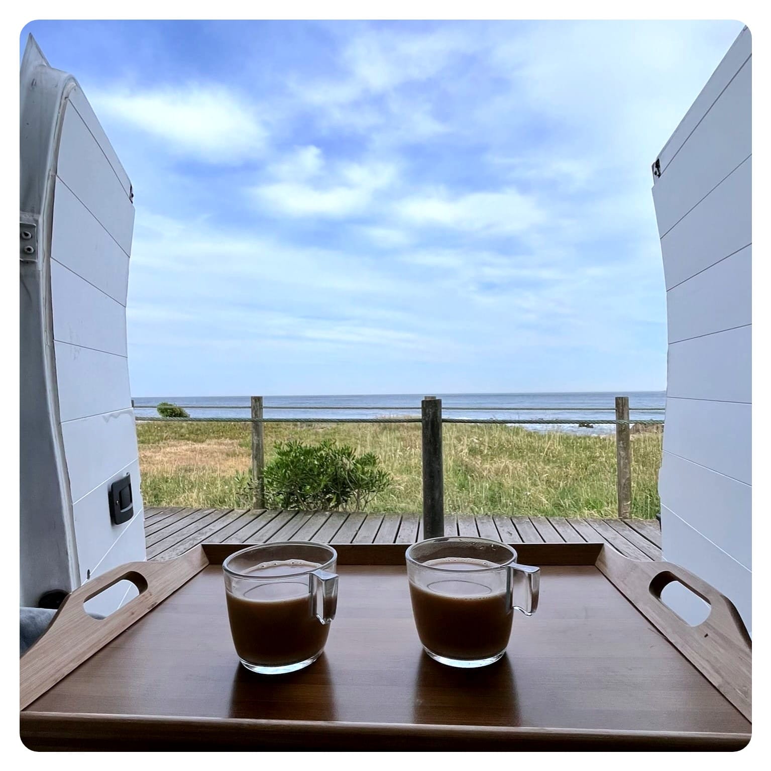 vanlife coffee overlooking beach view