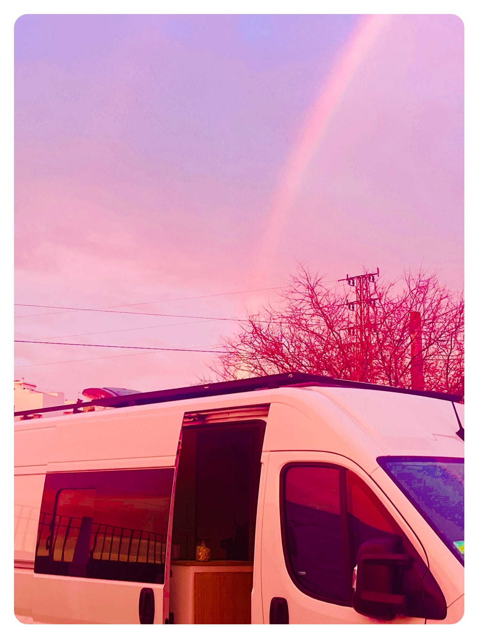 vanlife vanlavita with rainbow and pink sky