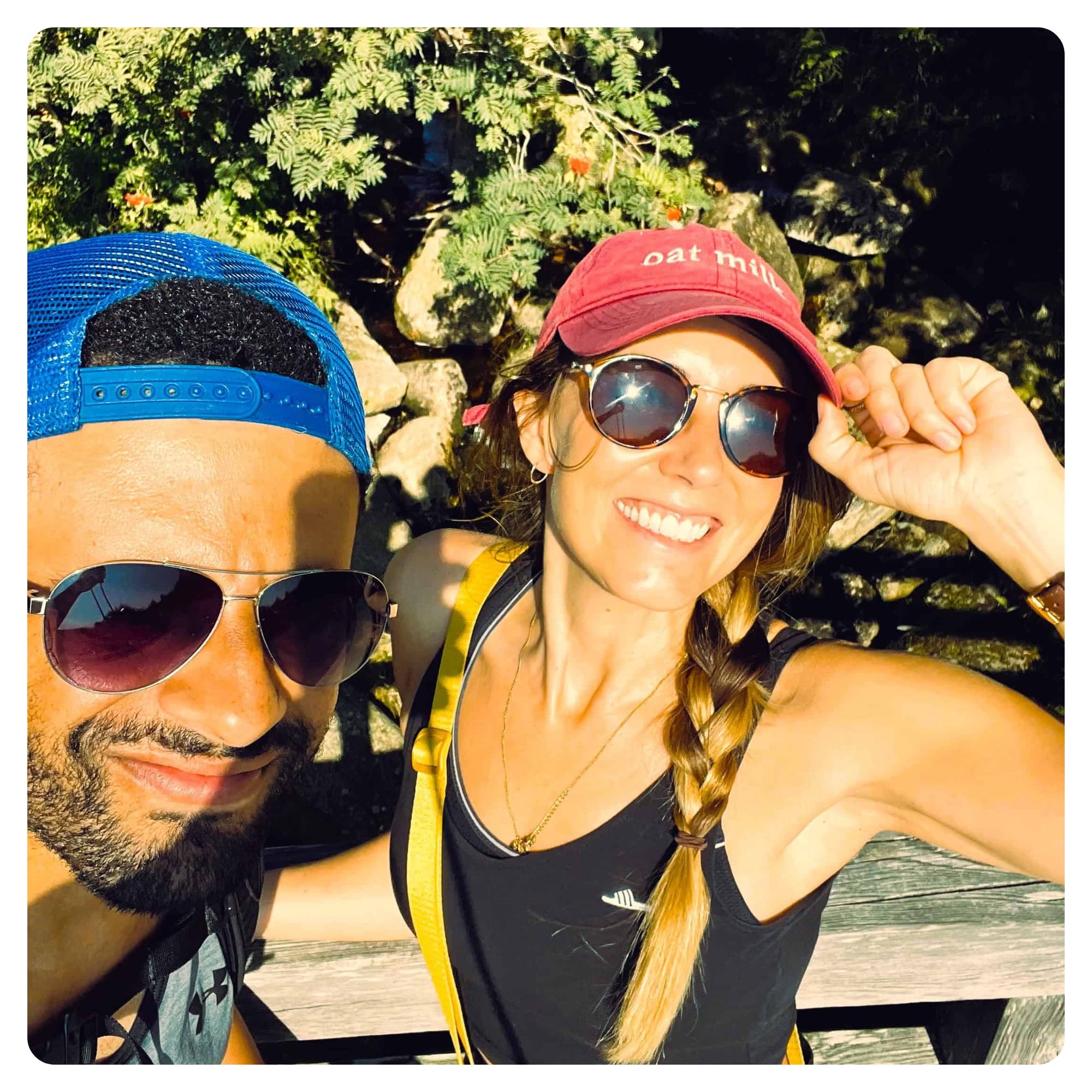 vanlavita mand and woman posing for photo wearing sunglasses while hiking 
