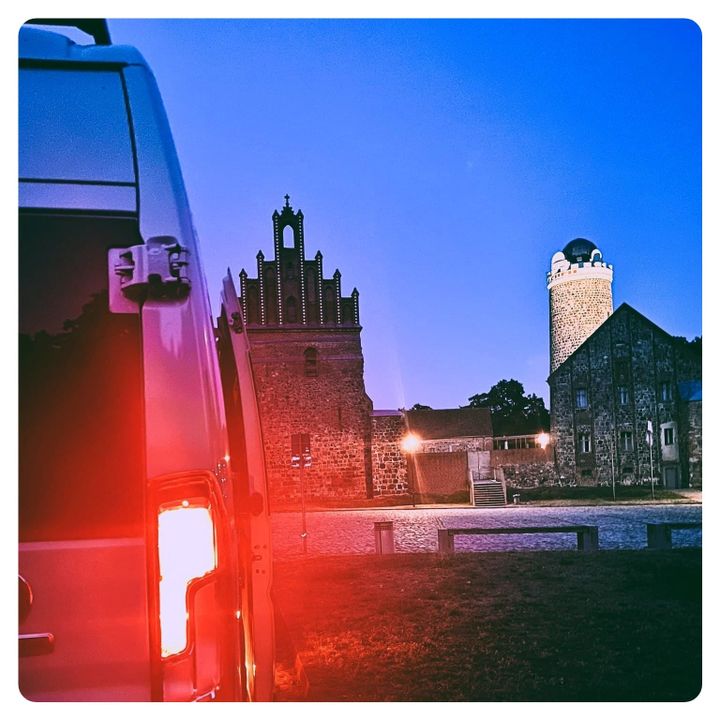 Van Life camper van at Ziesar Castle courtyard in Germany 