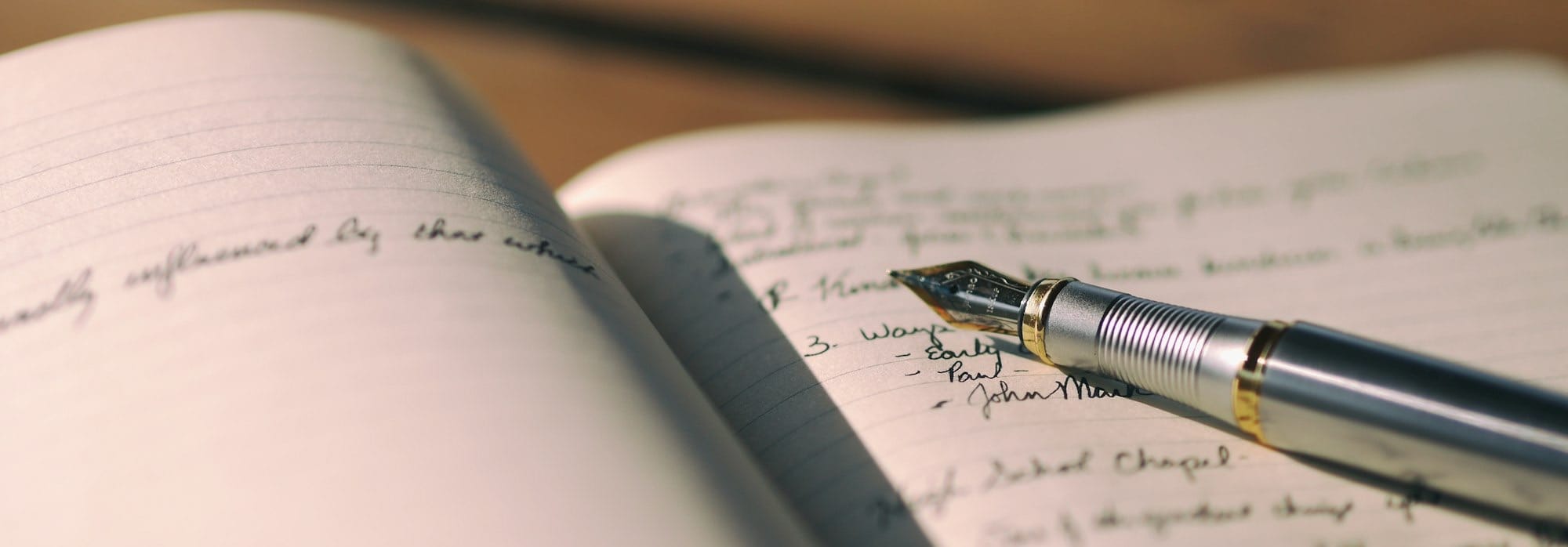 pen on white lined paper selective focus photography
