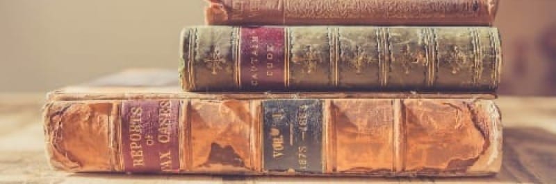 shallow focus photography of stack of books