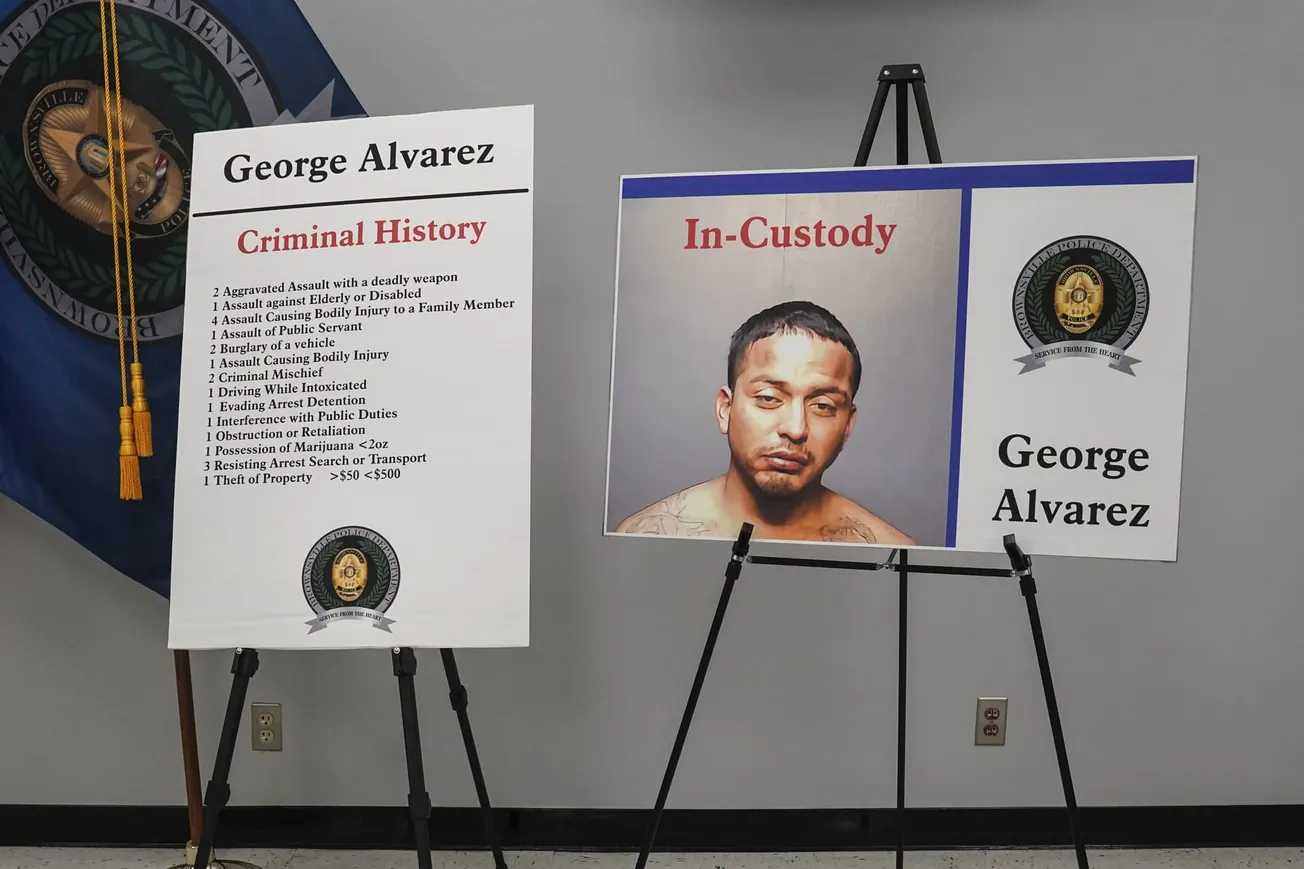 Display boards of George Alvarez’s criminal history and his photo at a news conference about the suspect in the Sunday killin