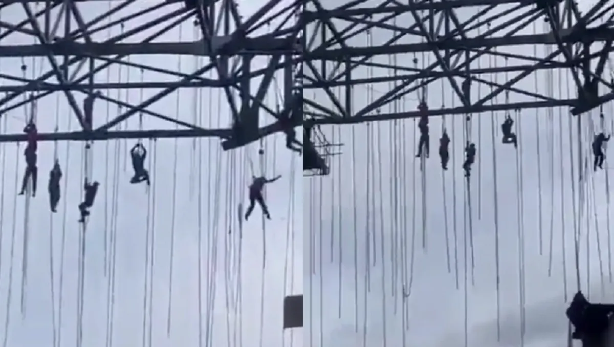 Obreros quedan colgando a unos 140 metros de altura tras desplomarse un andamio