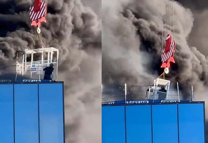 Operador de grúa salva a obrero de un incendio en un edificio