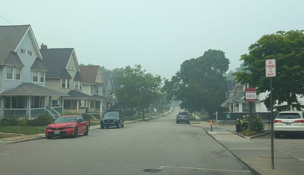 A street in Lakewood Ohio, visibly hazy from Canadian wildfire smoke.