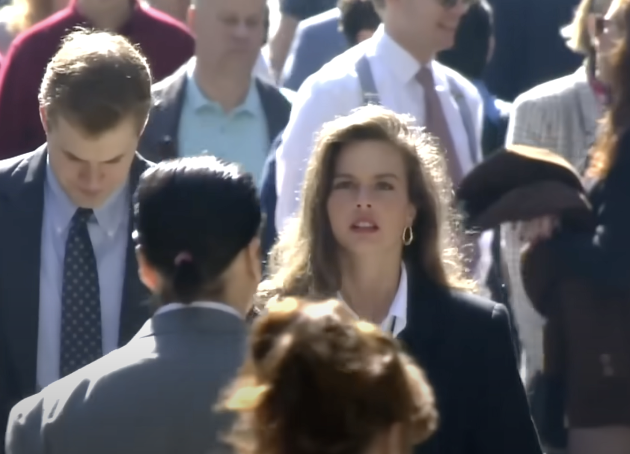 She's got some big earrings on. Which was the style at the time.