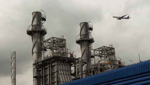 low-angle-view-smoke-stack-against-sky (1)