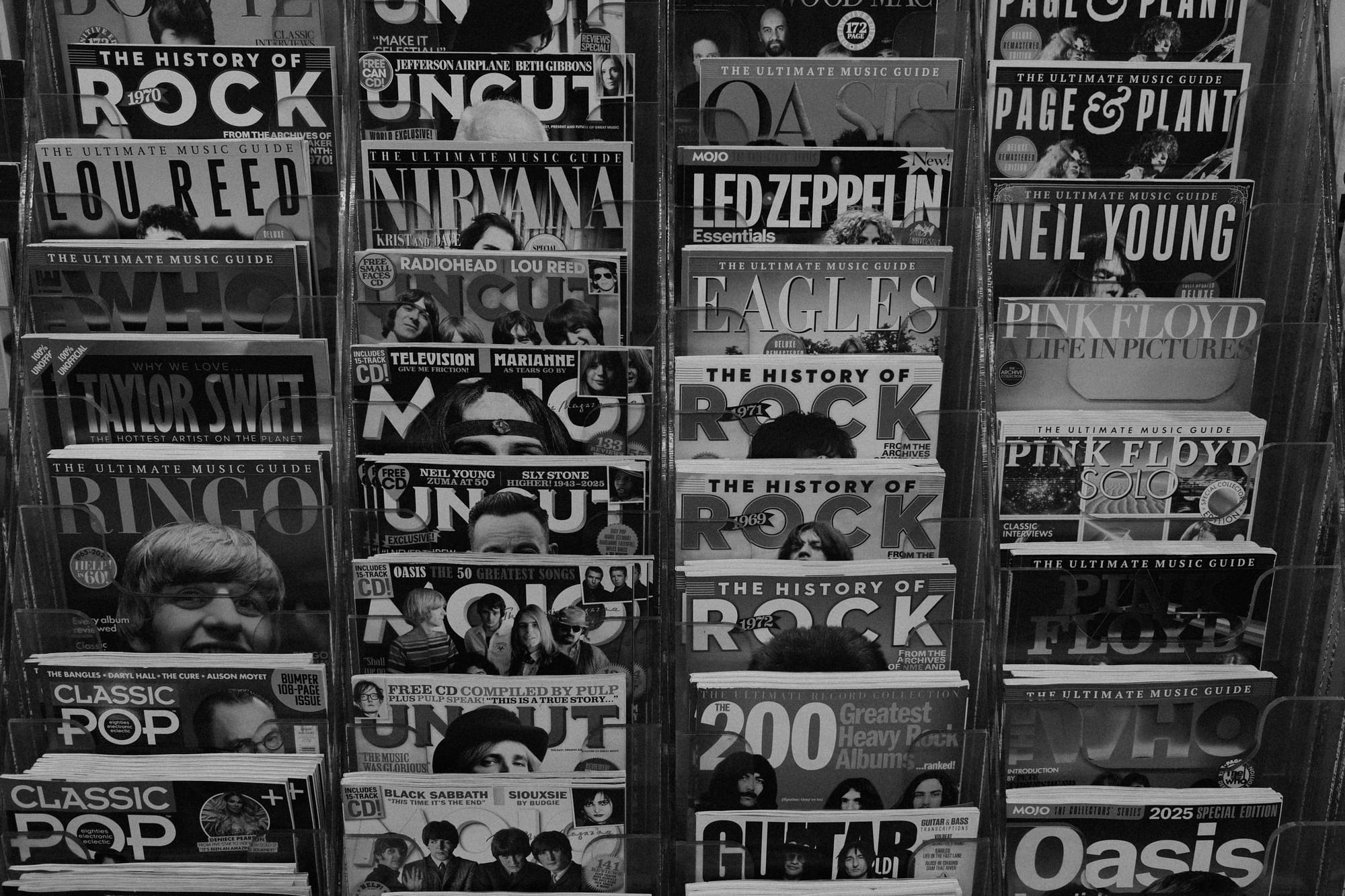 Magazine rack full of music magazines.