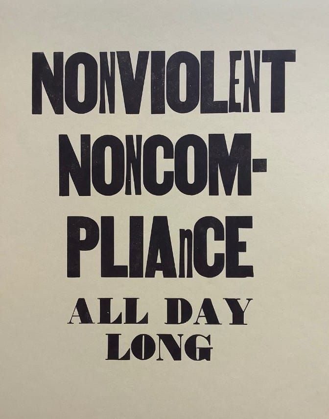A print that reads NONVIOLENT NONCOMPLIANCE ALL DAY LONG in a mix of fonts and sizes