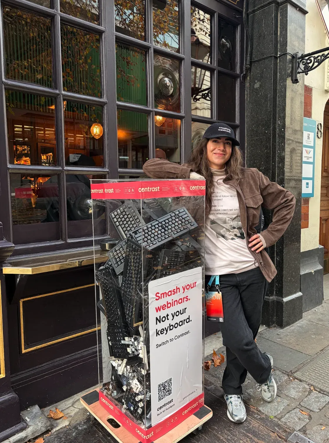 Photo of a girl and a bunch of smashed keyboards