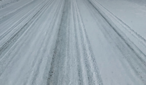 Eastbound Truck Overturns on Snow-Covered K-140, Driver Suffers Minor Injuries