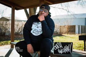 One Mic, One City: Cash Hollistah and the Art of Staying Local