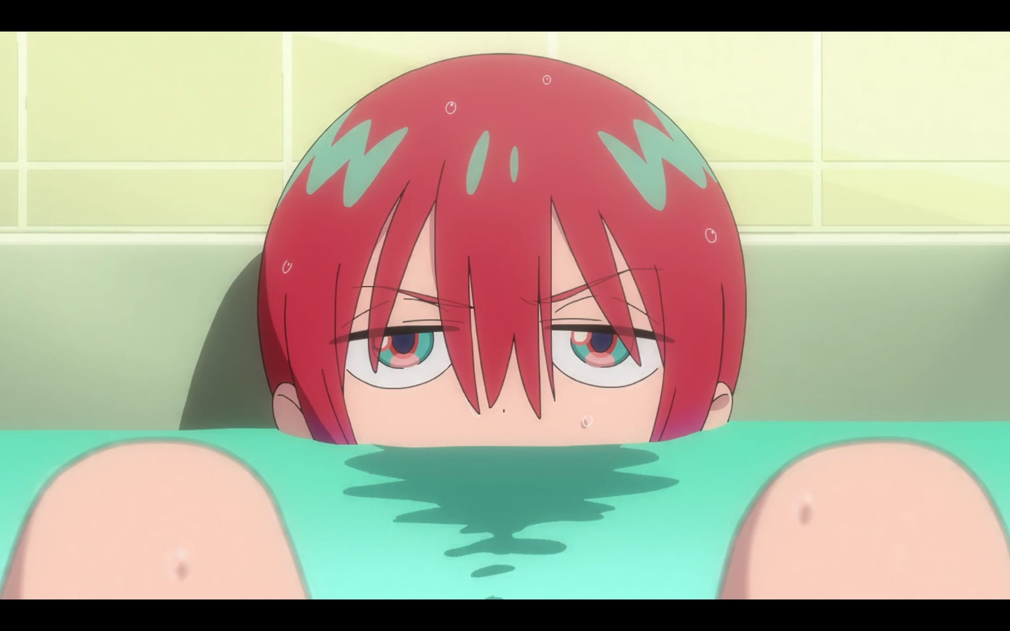 a grumpy machu lies in the bathtub