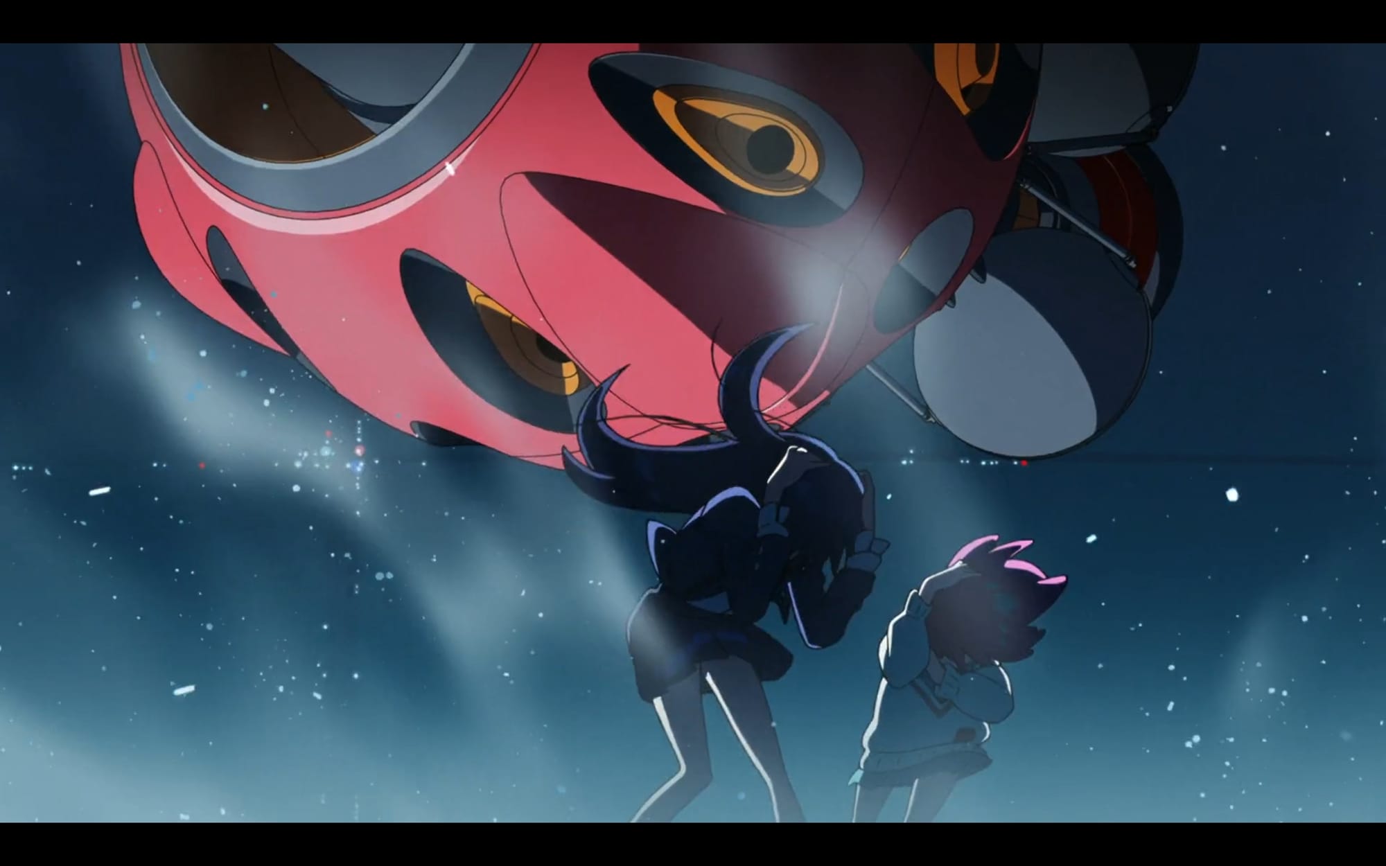 two girls brace themselves against wind and force generated by a giant red mecha bit